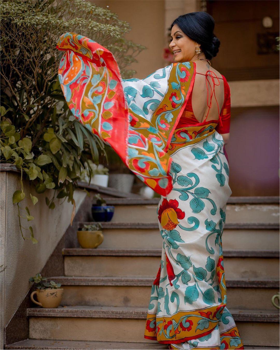 Floral Hand-Painted White Linen Saree with Vibrant Red & Yellow Accents